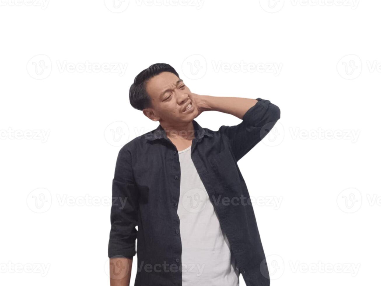 A man in a black shirt holds his neck with a pained expression, indicating discomfort or neck pain. The plain white background emphasizes his distress and highlights photo