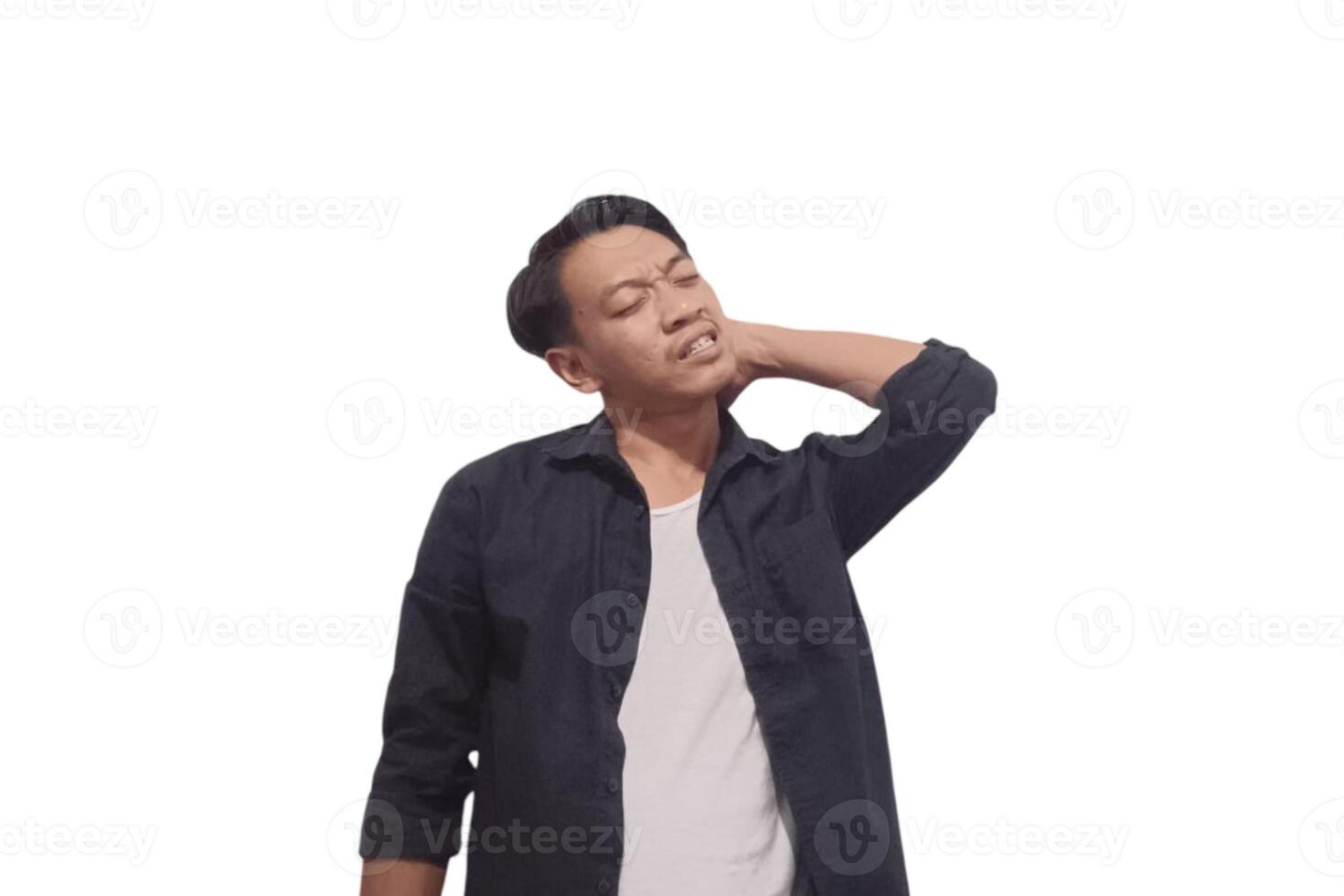 A man in a black shirt holds his neck with a pained expression, indicating discomfort or neck pain. The plain white background emphasizes his distress and highlights photo