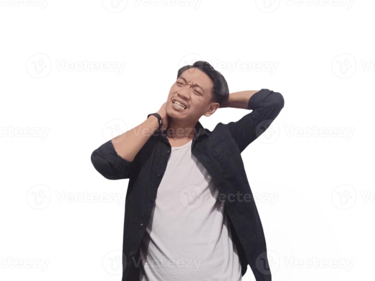 A man in a black shirt holds his neck with a pained expression, indicating discomfort or neck pain. The plain white background emphasizes his distress and highlights photo