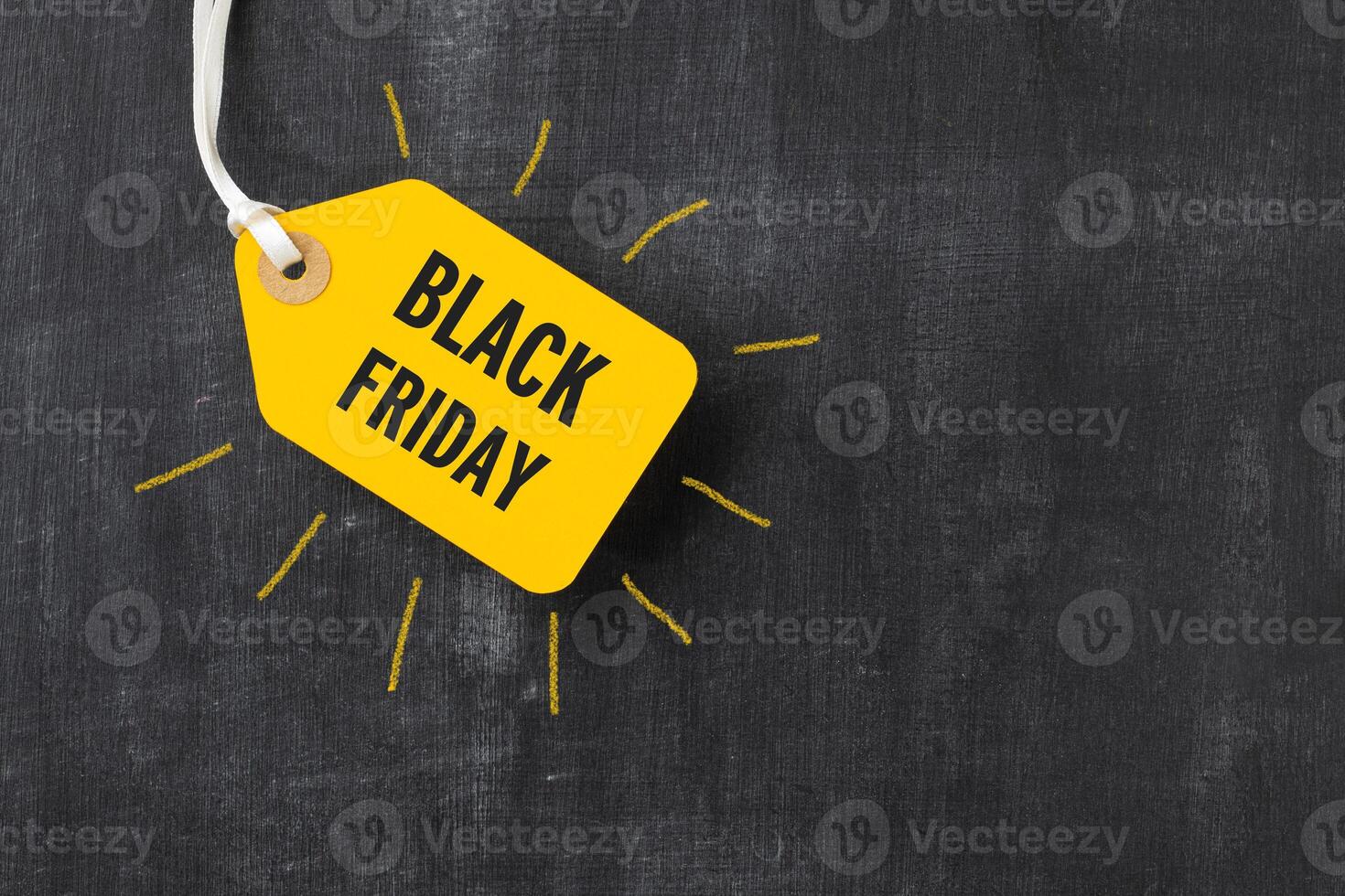 Sale tag with Black Friday written on blackboard photo