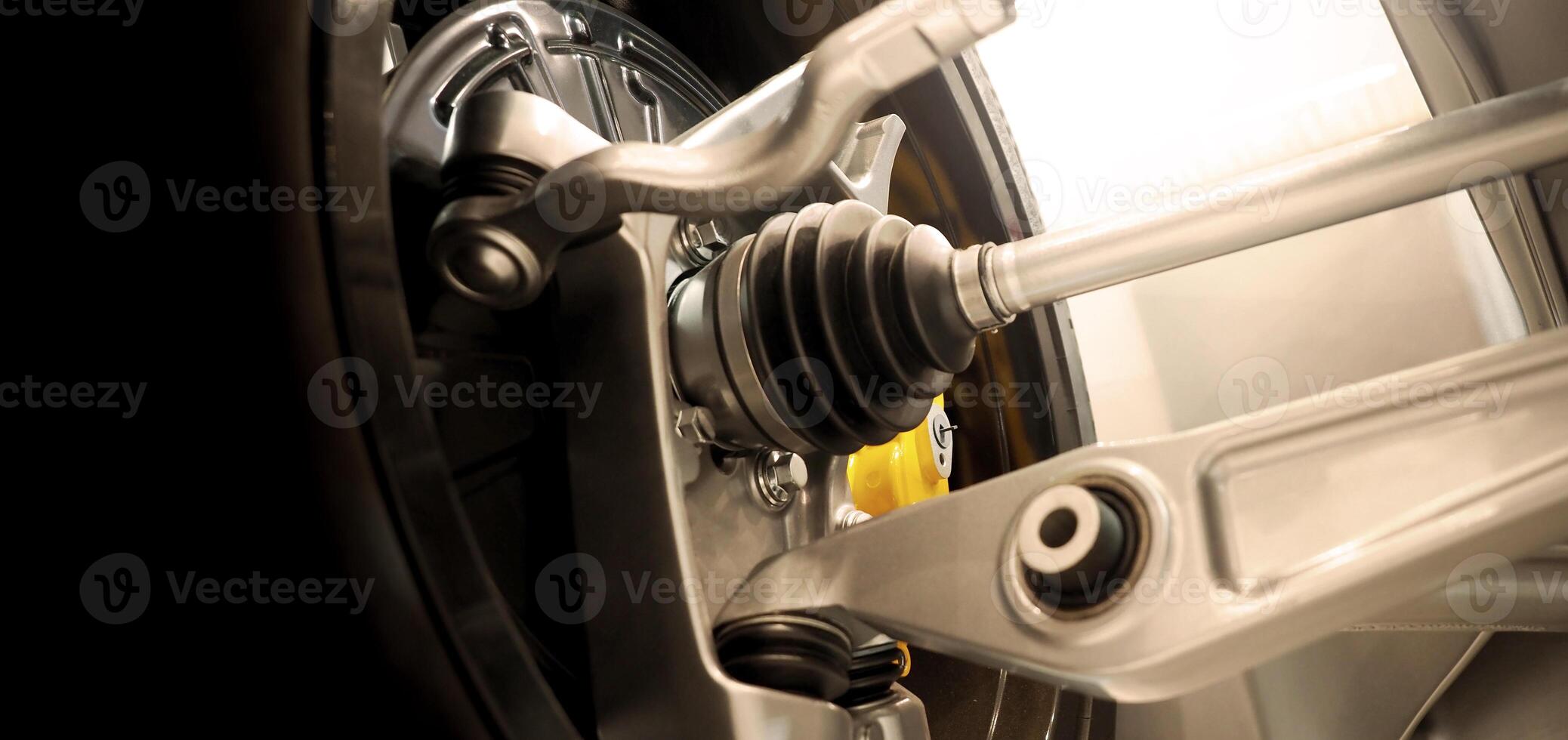 Car suspension and drive shaft. Structure of EV car spare parts. Such as Front or Rear suspension Shock absorber suspension Brake. Elements of the suspension and Chassis structure. Car service repair. photo