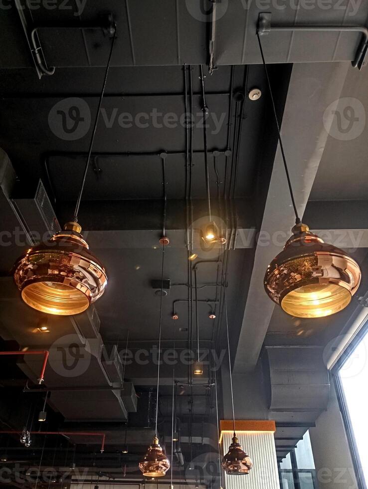 Photo of the lights and ceiling structure in a grill restaurant