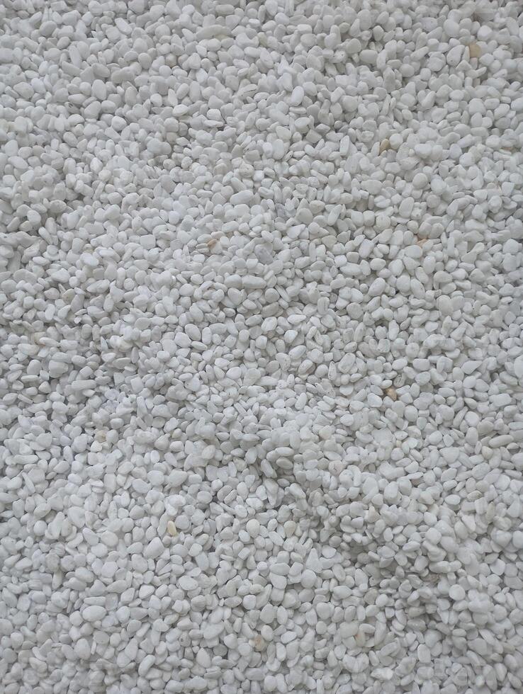 Photo of a textured background made of many small white stones