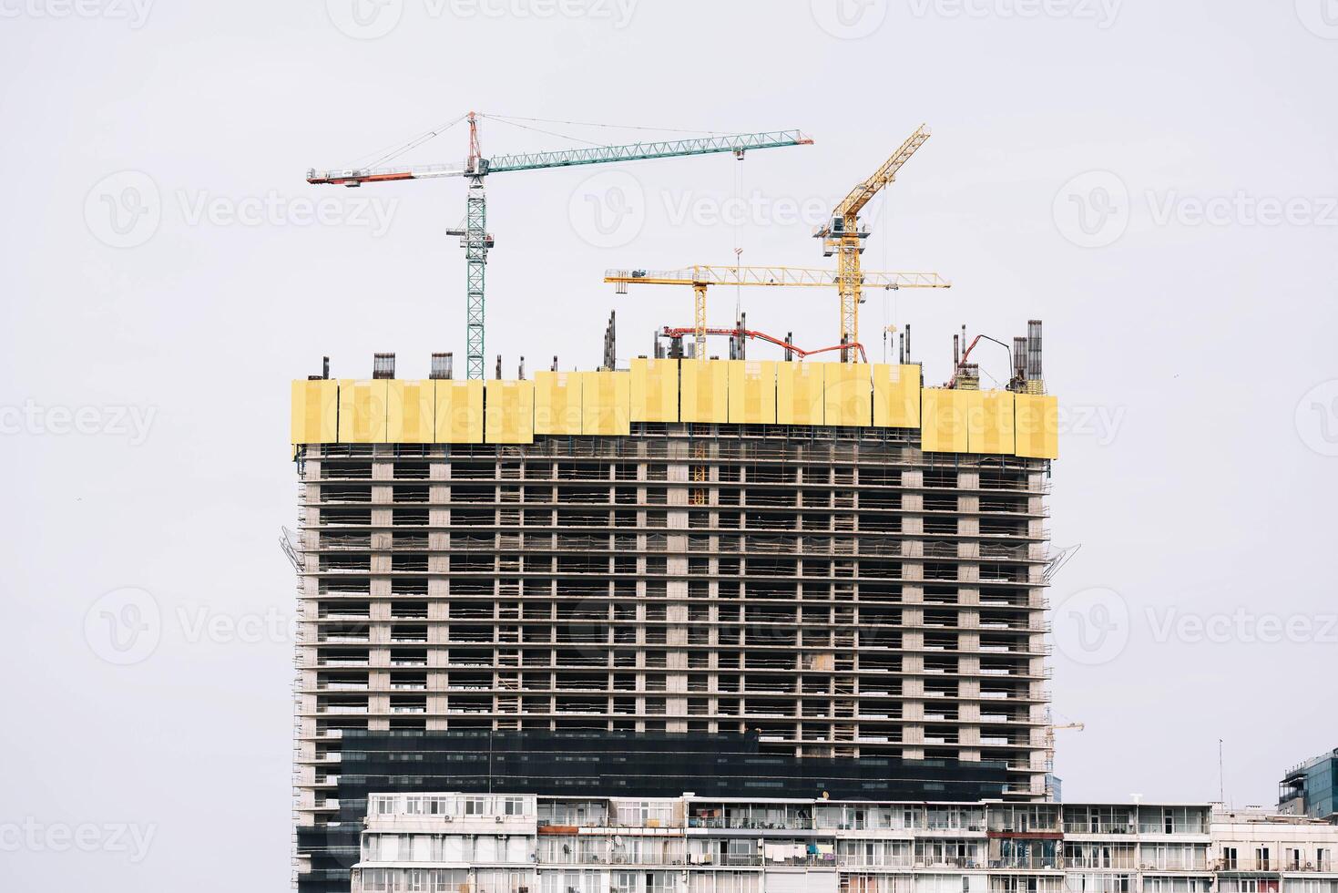 building under construction, construction site with crane photo