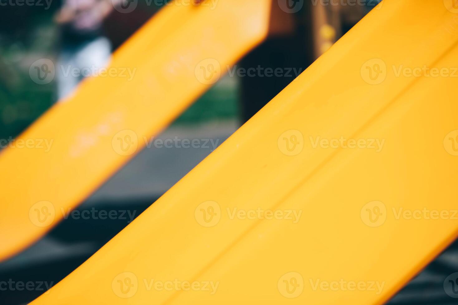 Roller coaster at the children's playground, yellow slide photo