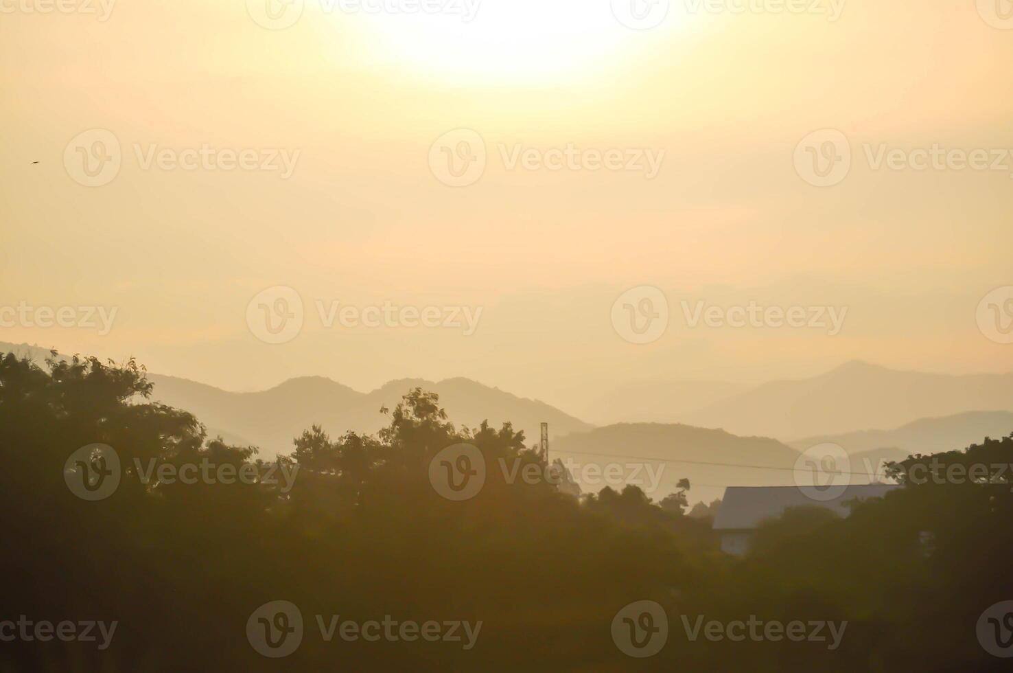 sky ,tree , mountain and house background or a house and tree photo