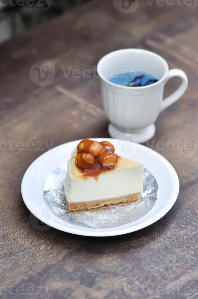 caramel macadamia cheesecake or nut cake,macadamia cake or Macadamia Nut cake or caramel cake and butterfly pea tea photo