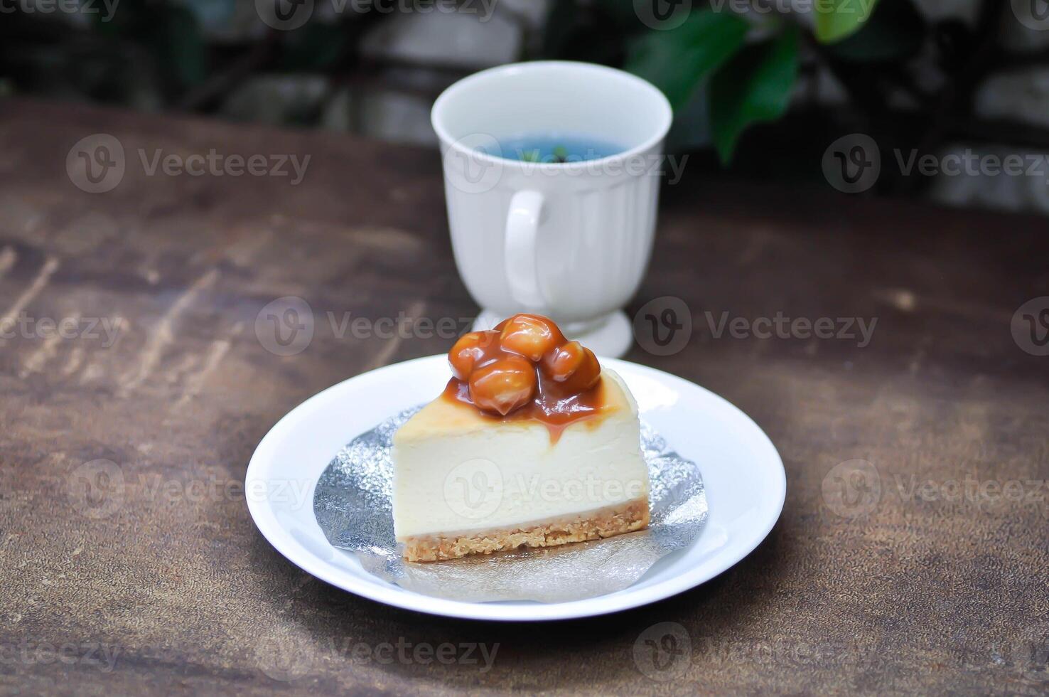 caramel macadamia cheesecake or nut cake,macadamia cake or Macadamia Nut cake or caramel cake and butterfly pea tea photo