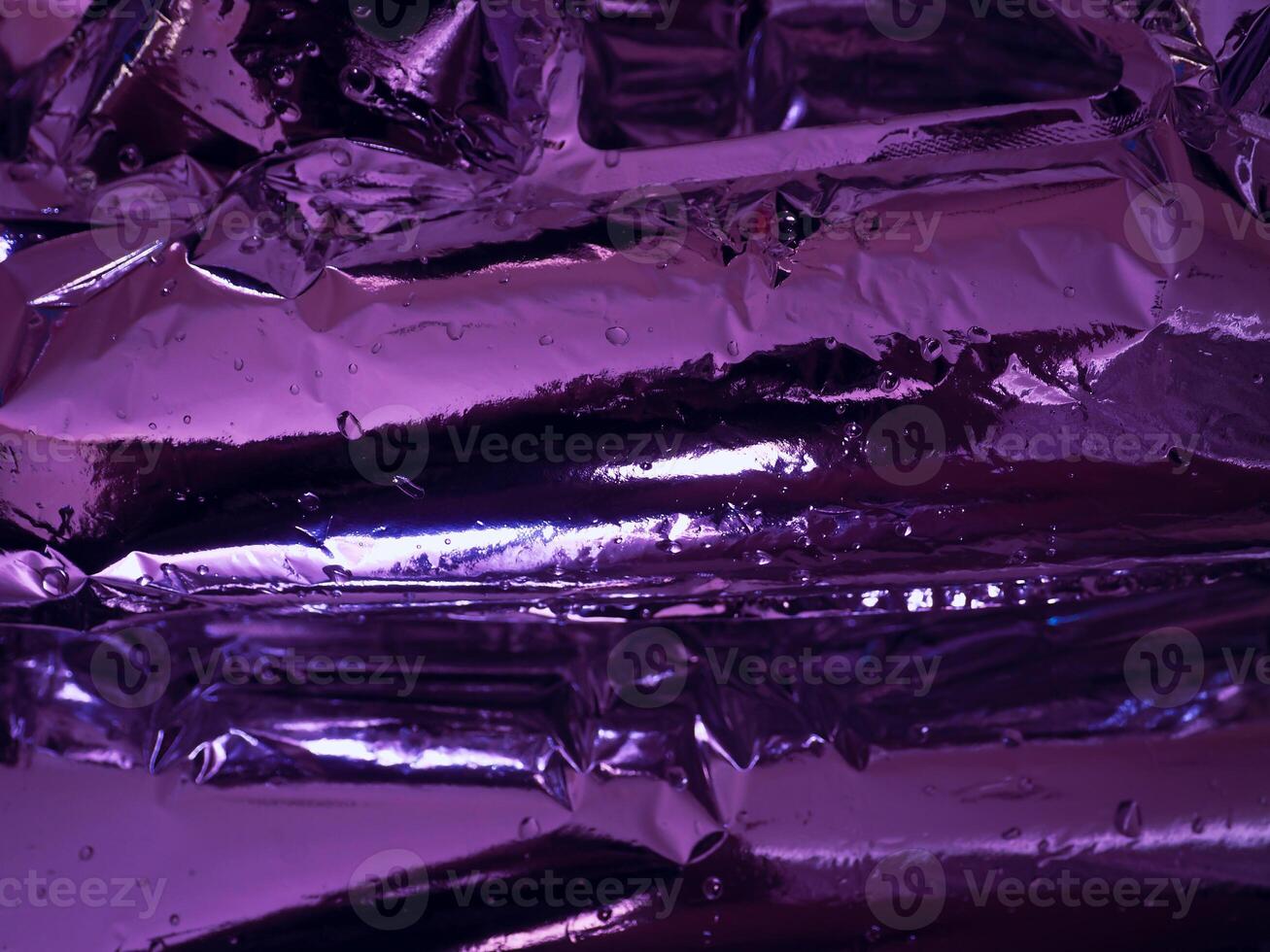 Plastic texture in dark purple light at night for abstract background photo