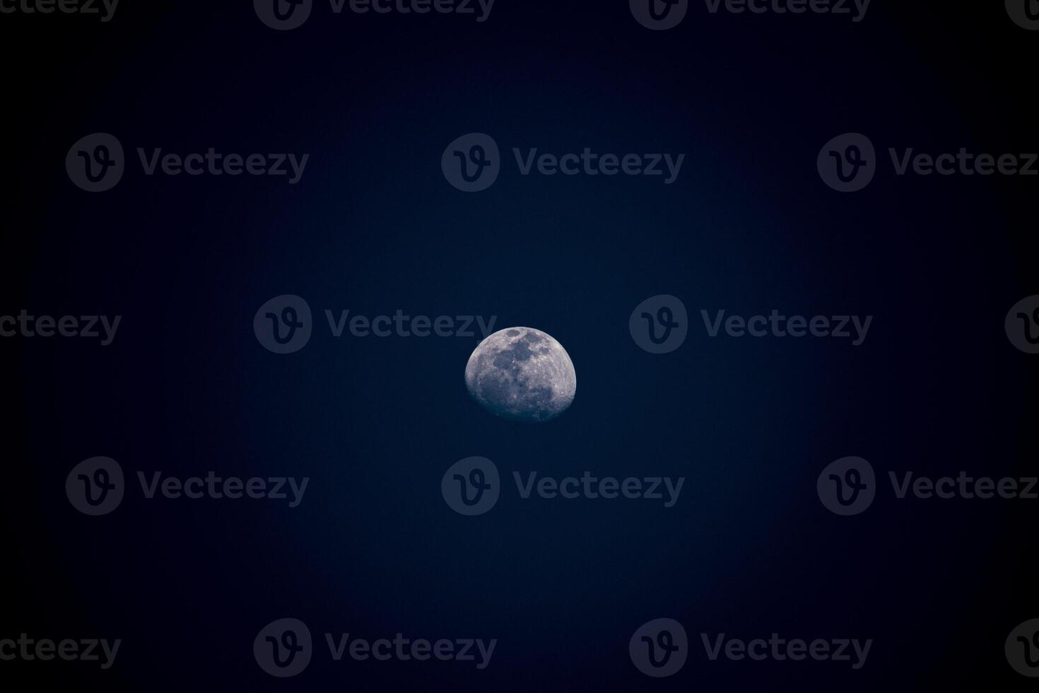 Half moon in the dark sky. An abstract background of lunar phase. photo