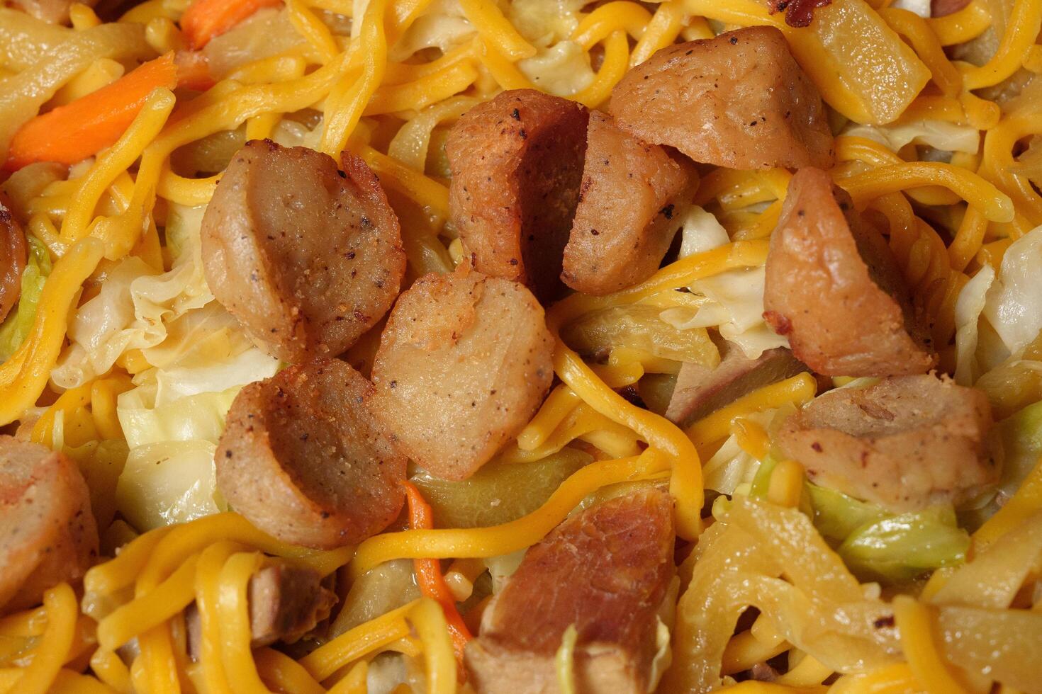 a plate of food with noodles and meat photo