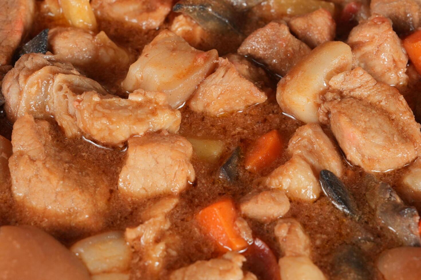 a close up of a stew with meat and vegetables photo