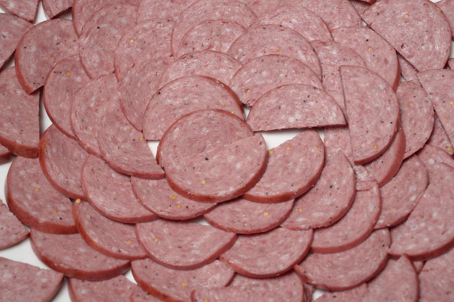 sliced sausages are arranged in a circle photo