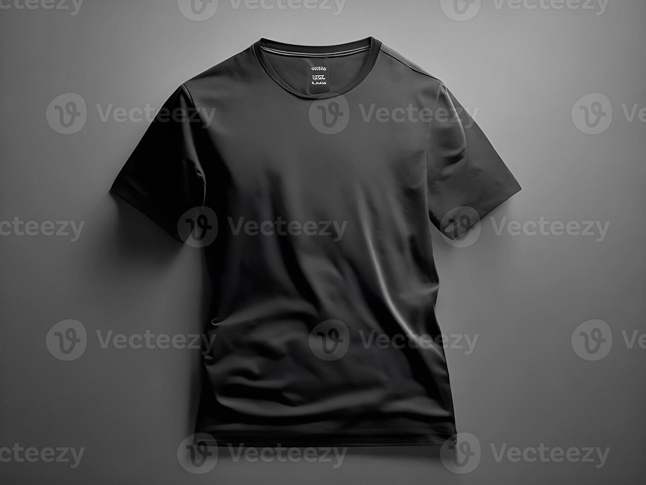 A black t shirt is hanging on a hanger with the word on it photo