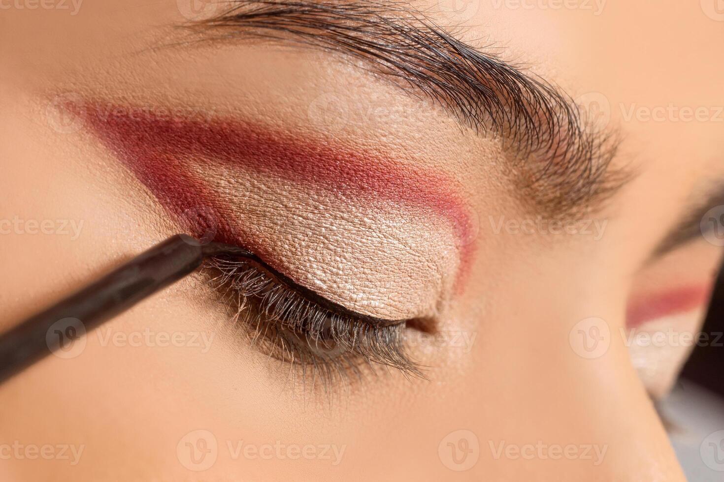Macro close up of eyeliner brush, make up concept. photo