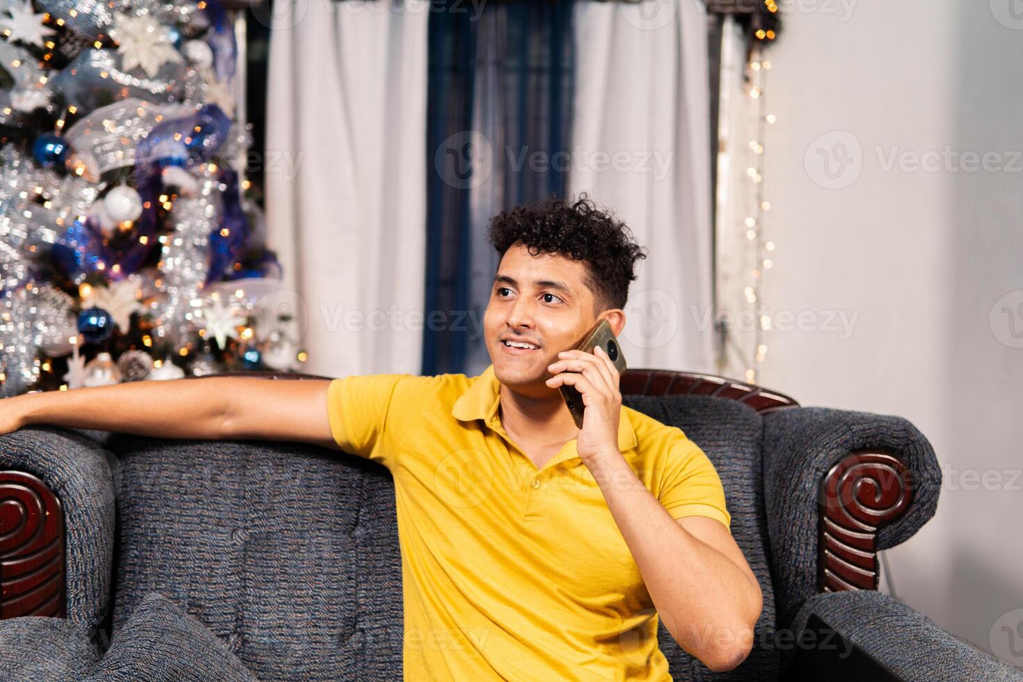 Portrait of young adult man using a phone while make a call phone. photo