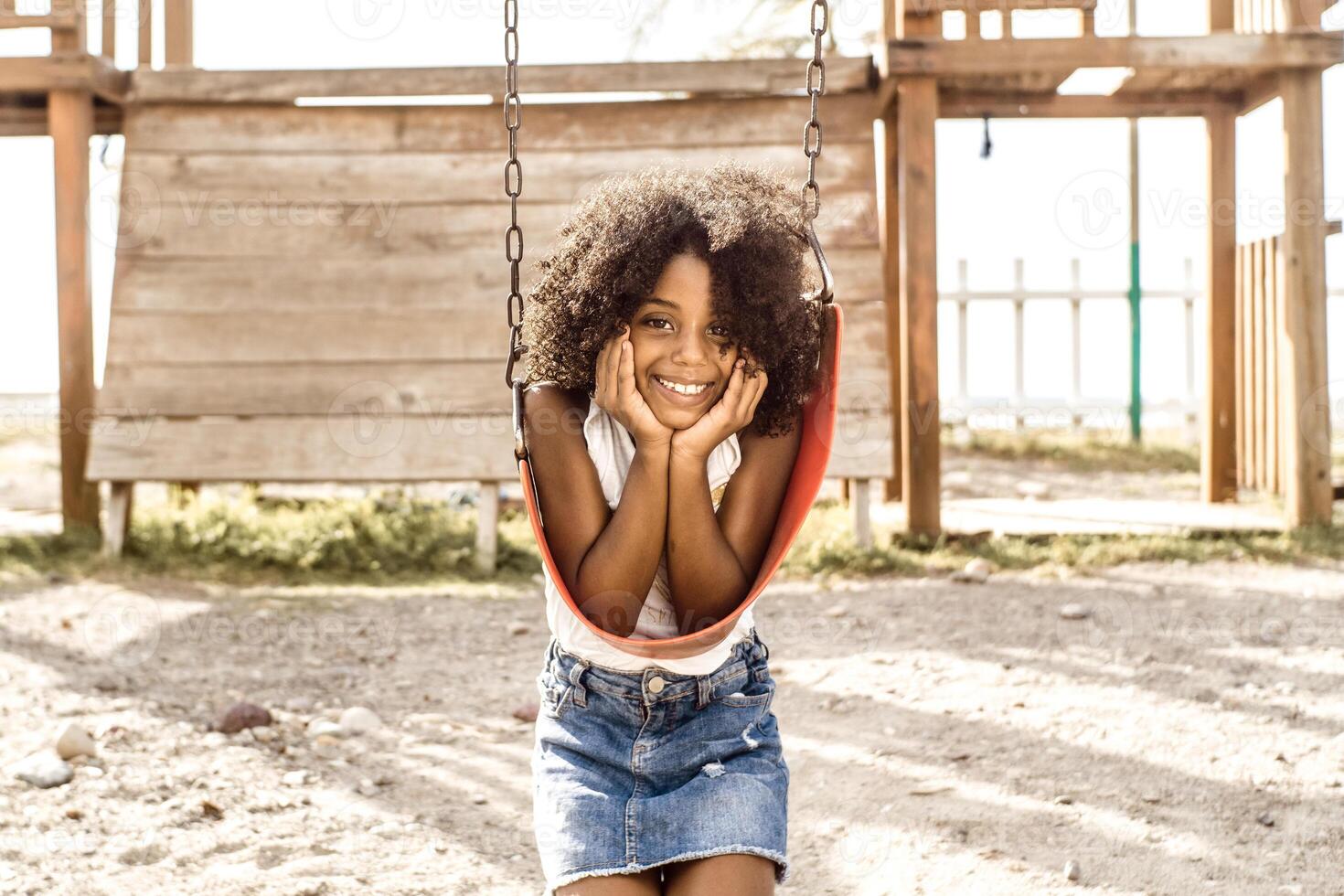 portrait of a smiling afro american girl look at camera. childhood and happiness concept. photo