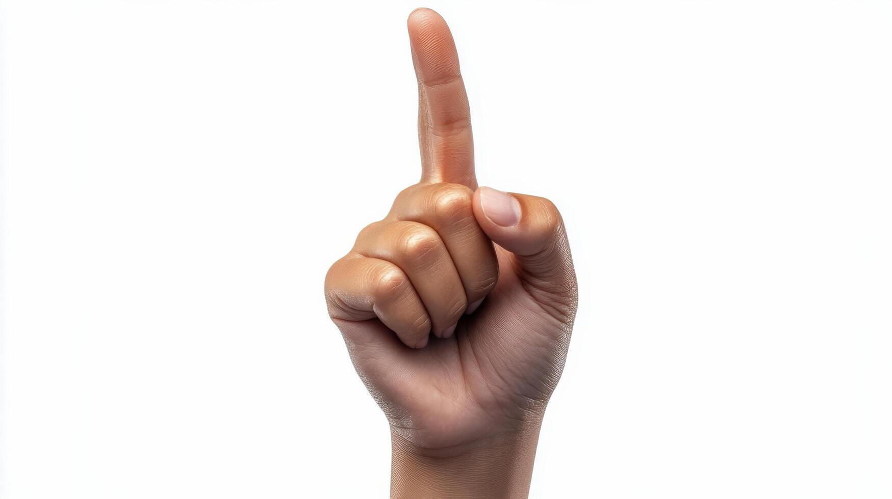 A hand pointing forward against a plain background during a bright daylight setting photo