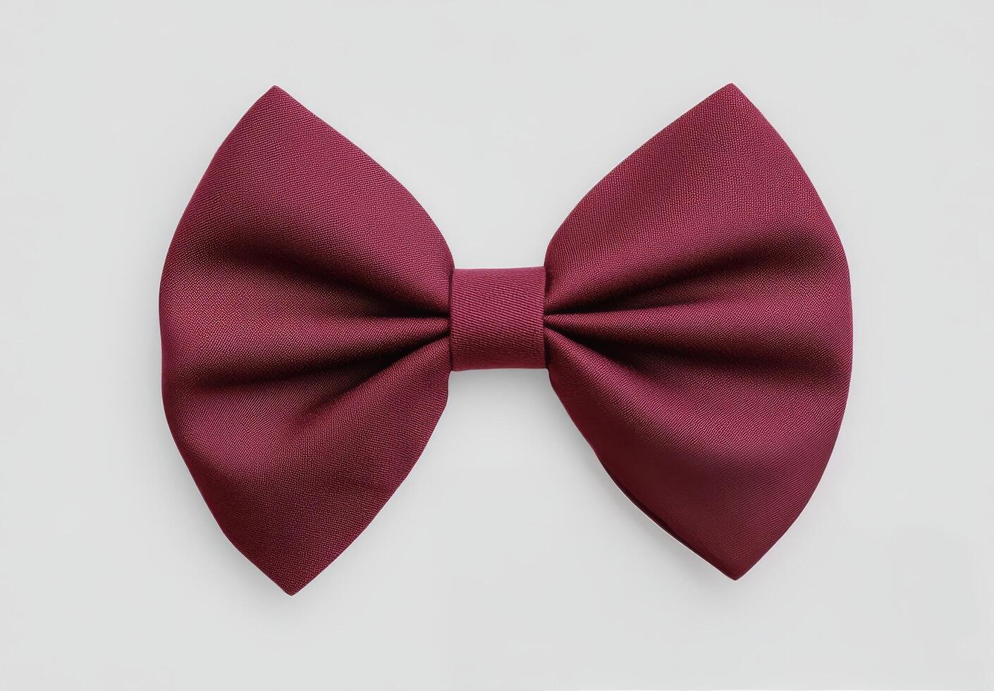 Elegant burgundy bowtie arranged neatly on a light background for formal wear styling photo