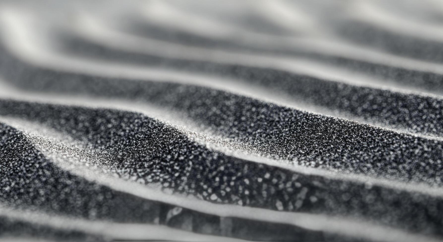 Abstract patterns of black and white sand at a beach during sunrise photo