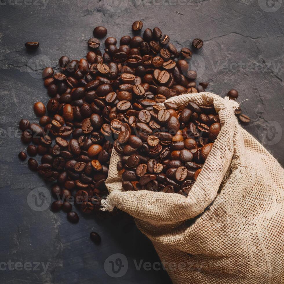 Dark brown coffee beans being poured out of a sack on a wooden background. This image conveys the freshness and aroma of the coffee beans. photo