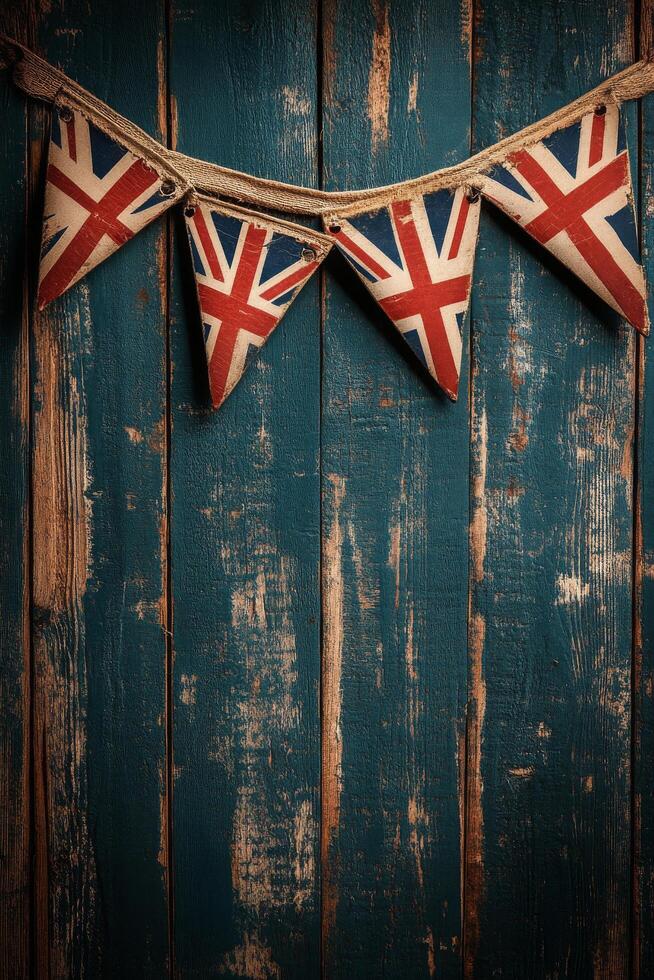 Decorative Union Jack bunting hanging on a rustic blue wooden wall for a festive atmosphere photo