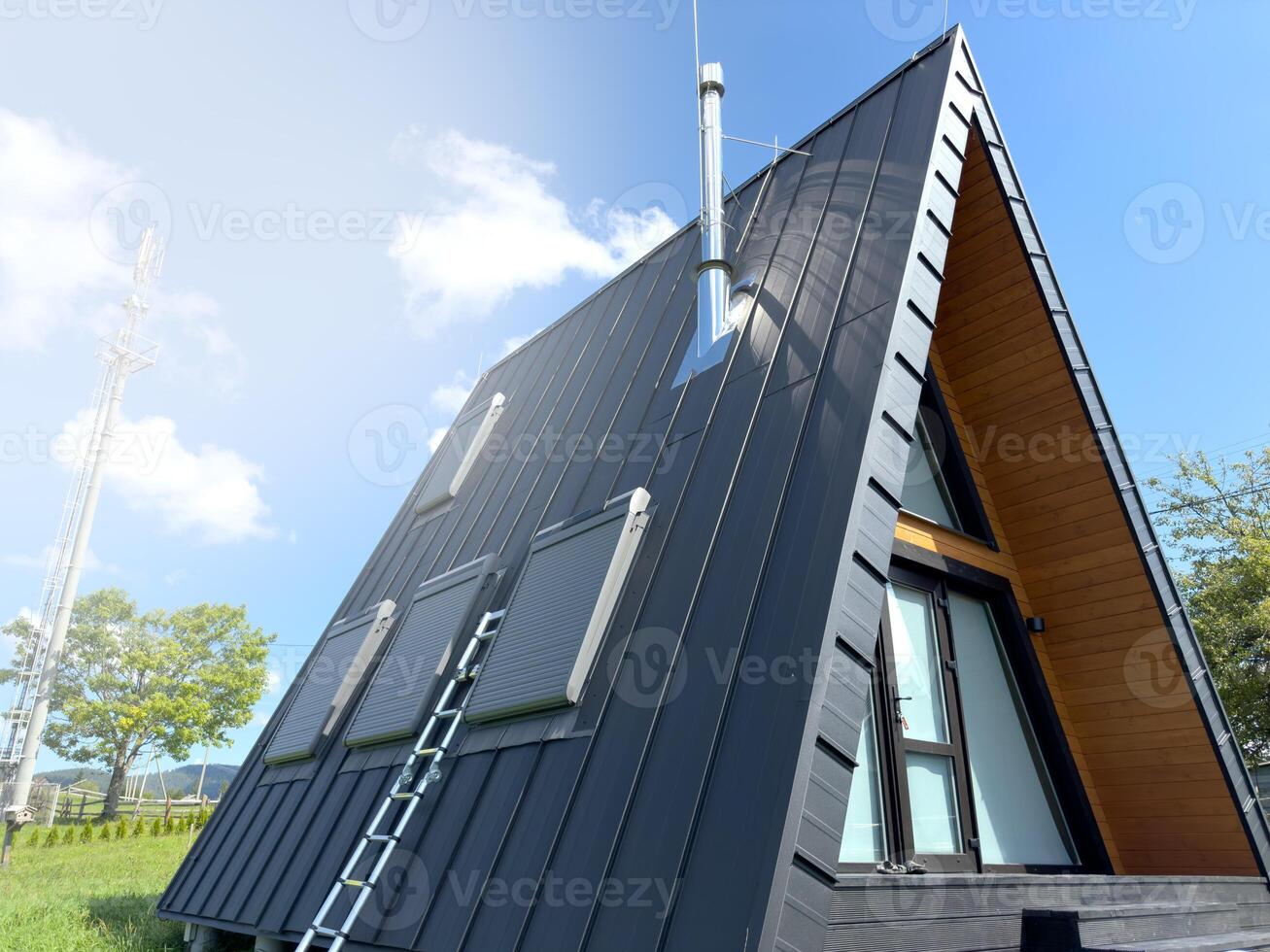 Professional service of skylights. Roof windows in a modern modular frame house. photo
