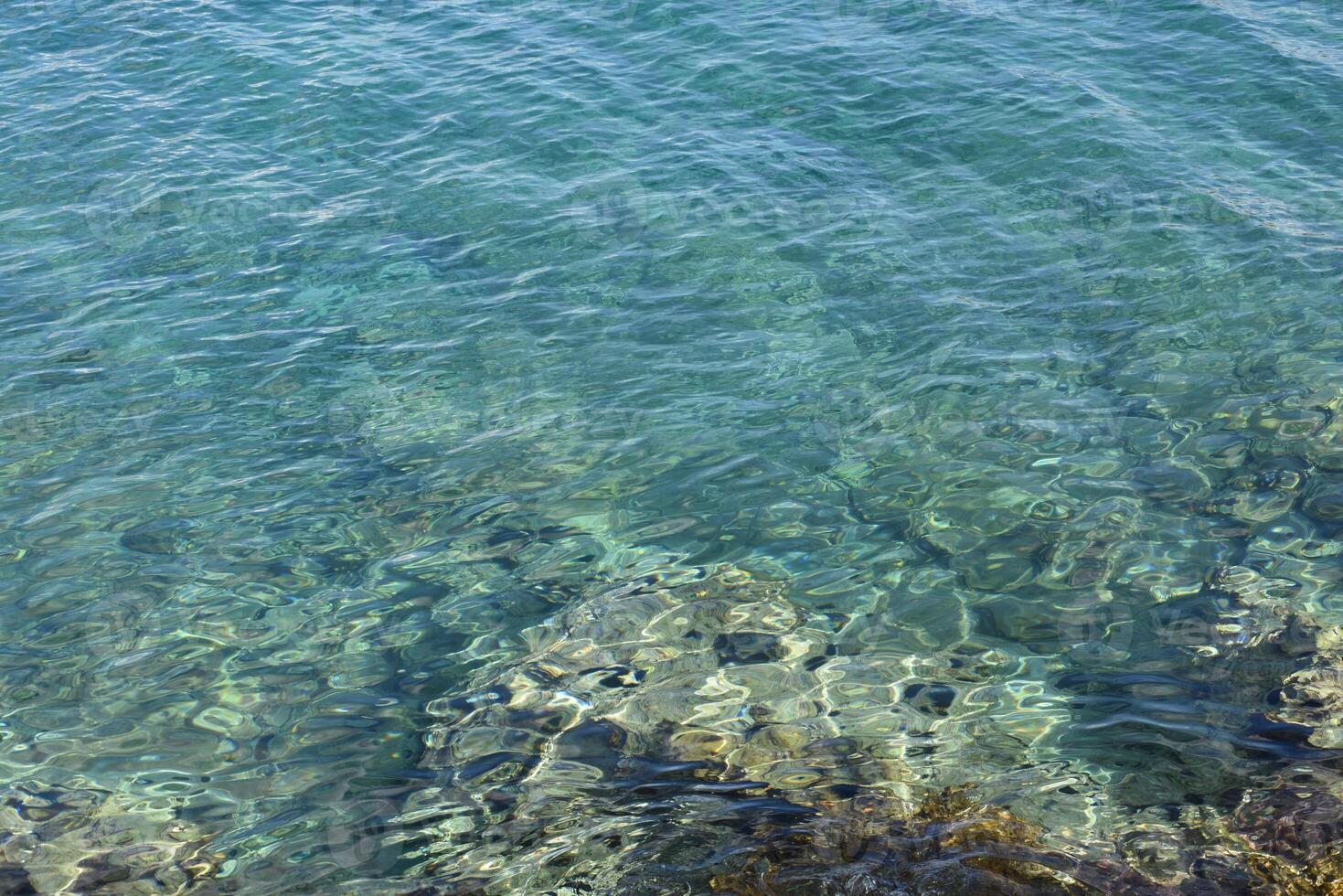 Beautiful, calm blue green water of the Adriatic Sea, Lumbarda, Croatia. photo