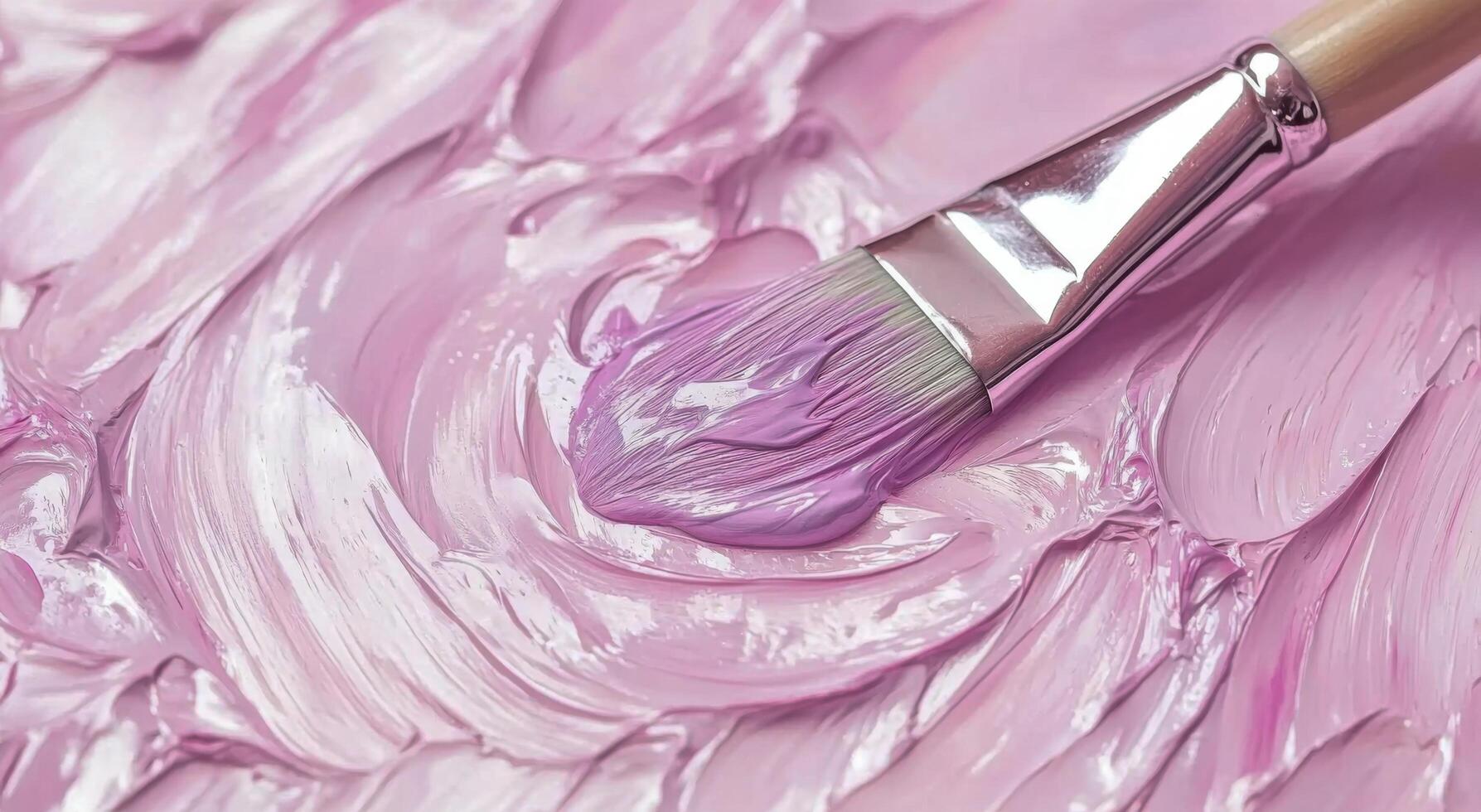 A close-up of a paintbrush applying lavender paint to a textured canvas surface in an art studio photo
