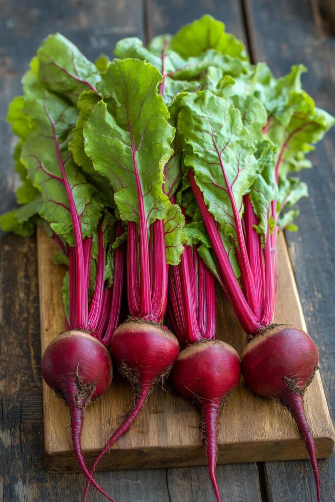 Freshly sliced beetroots displayed in a rustic wooden bowl with whole beets in the background photo
