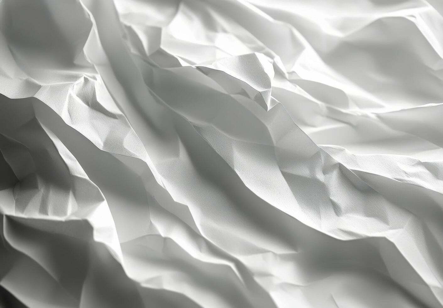 Textured white paper layers creating a delicate and intricate pattern in soft lighting photo