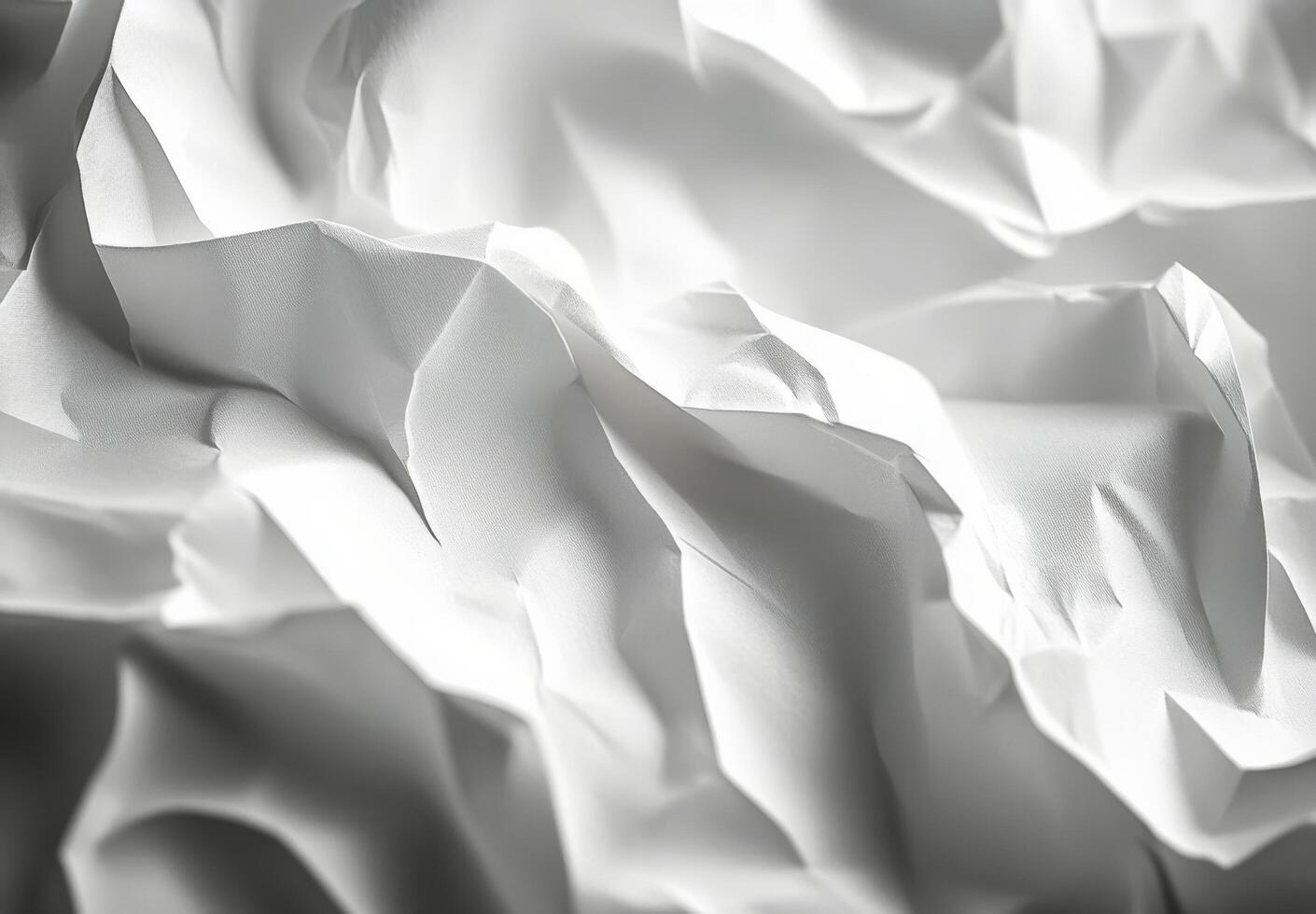Textured white paper layers creating a delicate and intricate pattern in soft lighting photo
