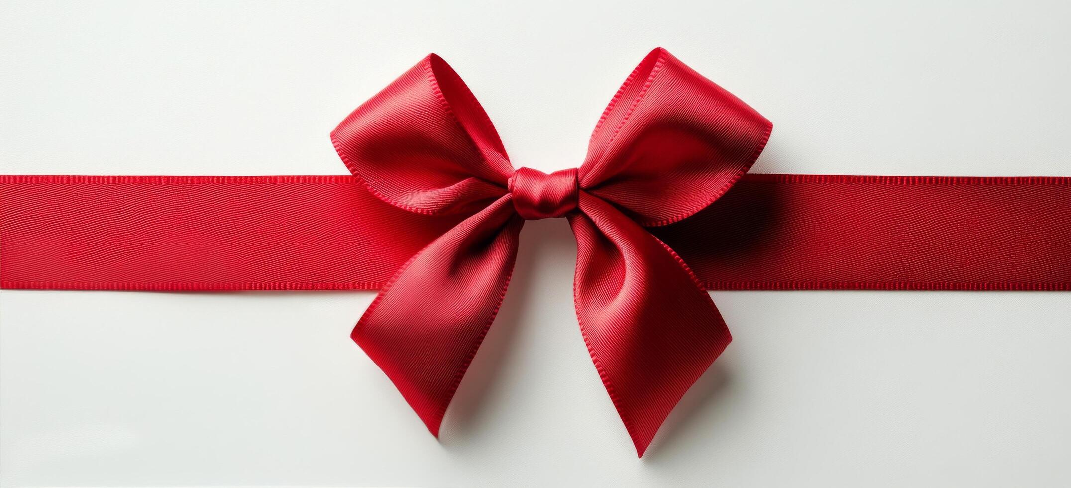 A beautifully crafted red ribbon and bow on a white background creating an elegant gift wrap photo