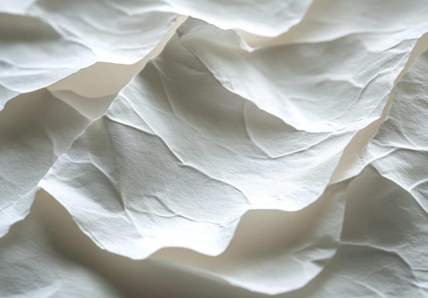 Textured white paper layers creating a delicate and intricate pattern in soft lighting photo