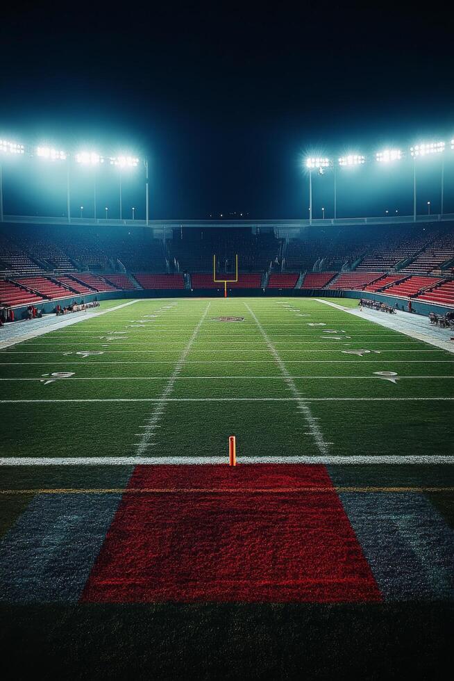 A vibrant football stadium under bright lights with an expansive green field during nighttime photo