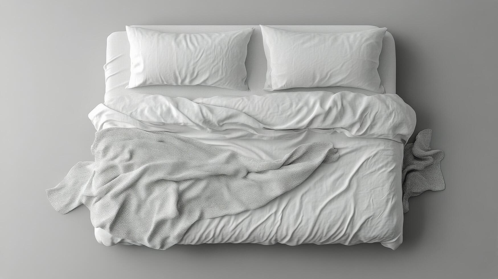 Cozy white bed with rumpled blankets and pillows in a minimalist bedroom setting photo
