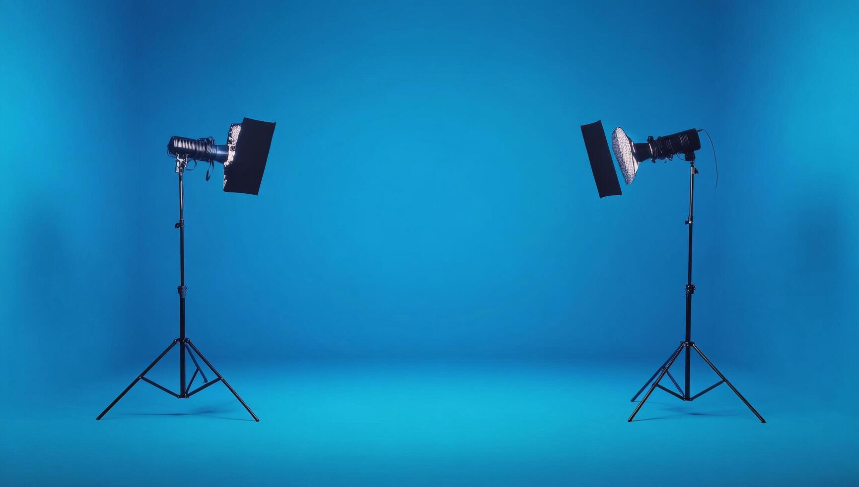 Studio setup with softboxes illuminating a blue backdrop for photography sessions photo