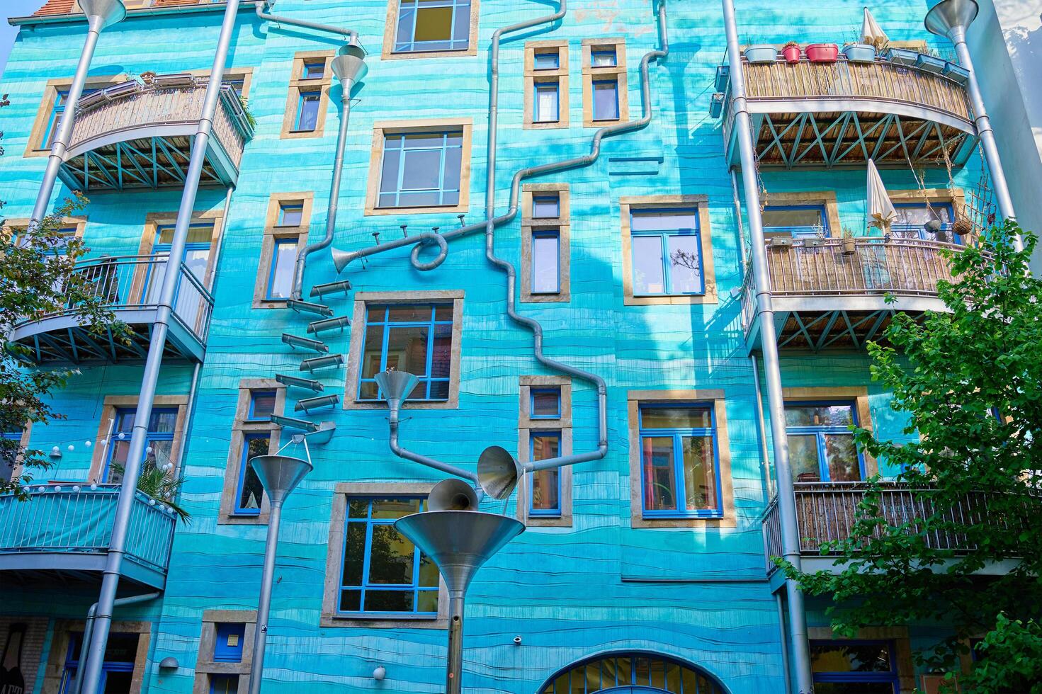 Kunsthofpassage in Neustadt district of Dresden, Germany. Quirky facade of residential building featuring musical instrument. Dresden, Germany - May 4, 2024 photo