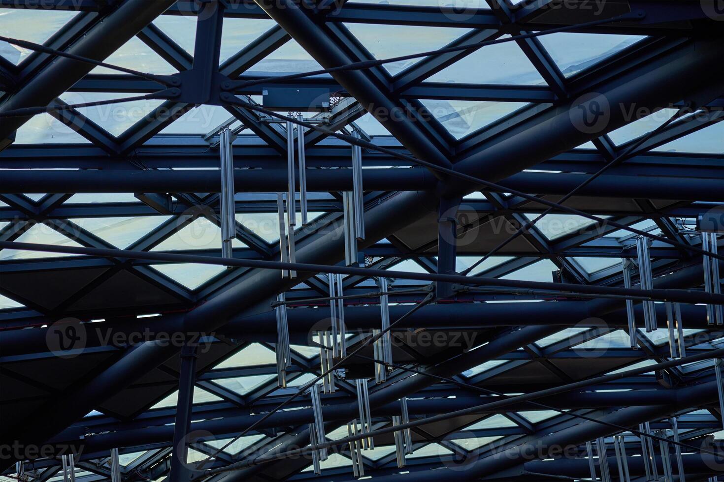 Modern building ceiling composed of metal beams and glass panels. Contemporary architecture elements photo