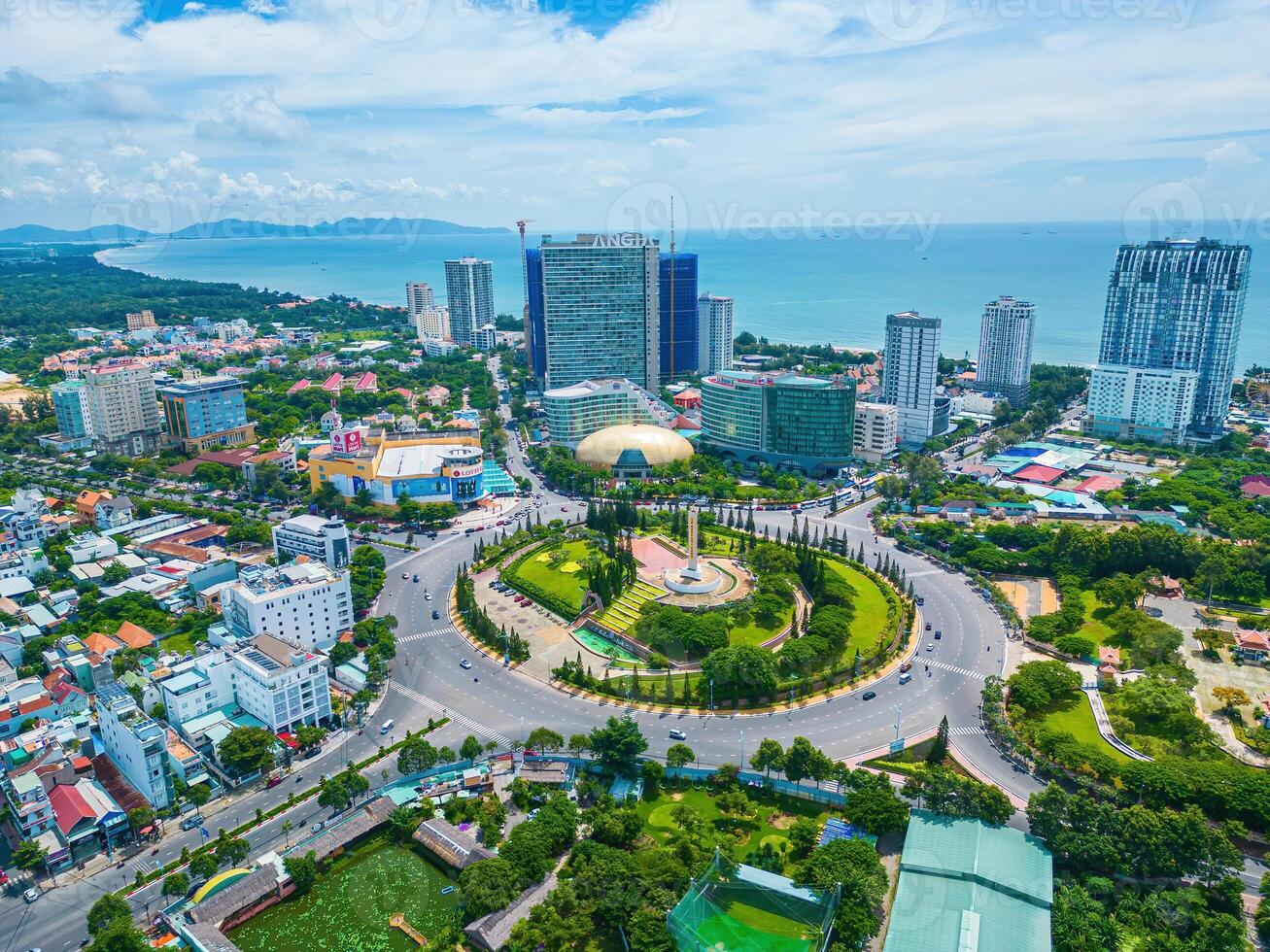 Vung Tau view from above, with traffic roundabout, house, Vietnam war memorial in Vietnam. This is the biggest roundabout in Vung Tau. photo