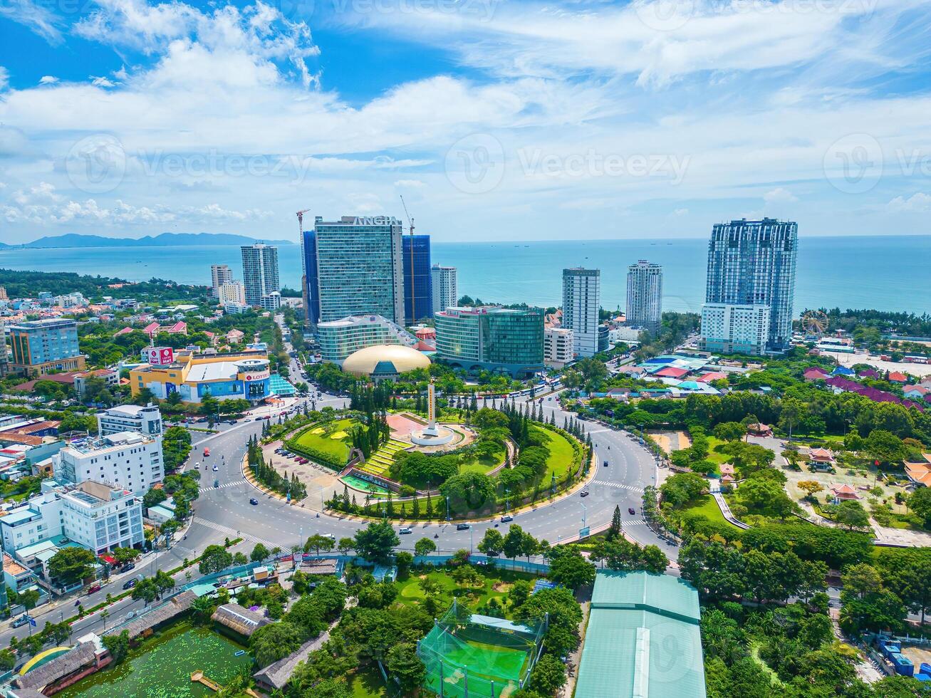 Vung Tau view from above, with traffic roundabout, house, Vietnam war memorial in Vietnam. This is the biggest roundabout in Vung Tau. photo