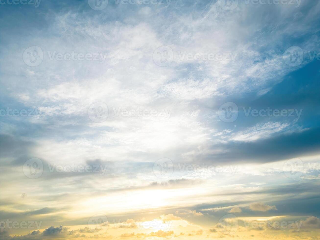 Beautiful view of blue sky with clouds at sunrise. Partly cloudy.Background cloud summer. Cloud summer. Sky cloud clear with sunset. Natural sky cinematic beautiful yellow and white texture background photo