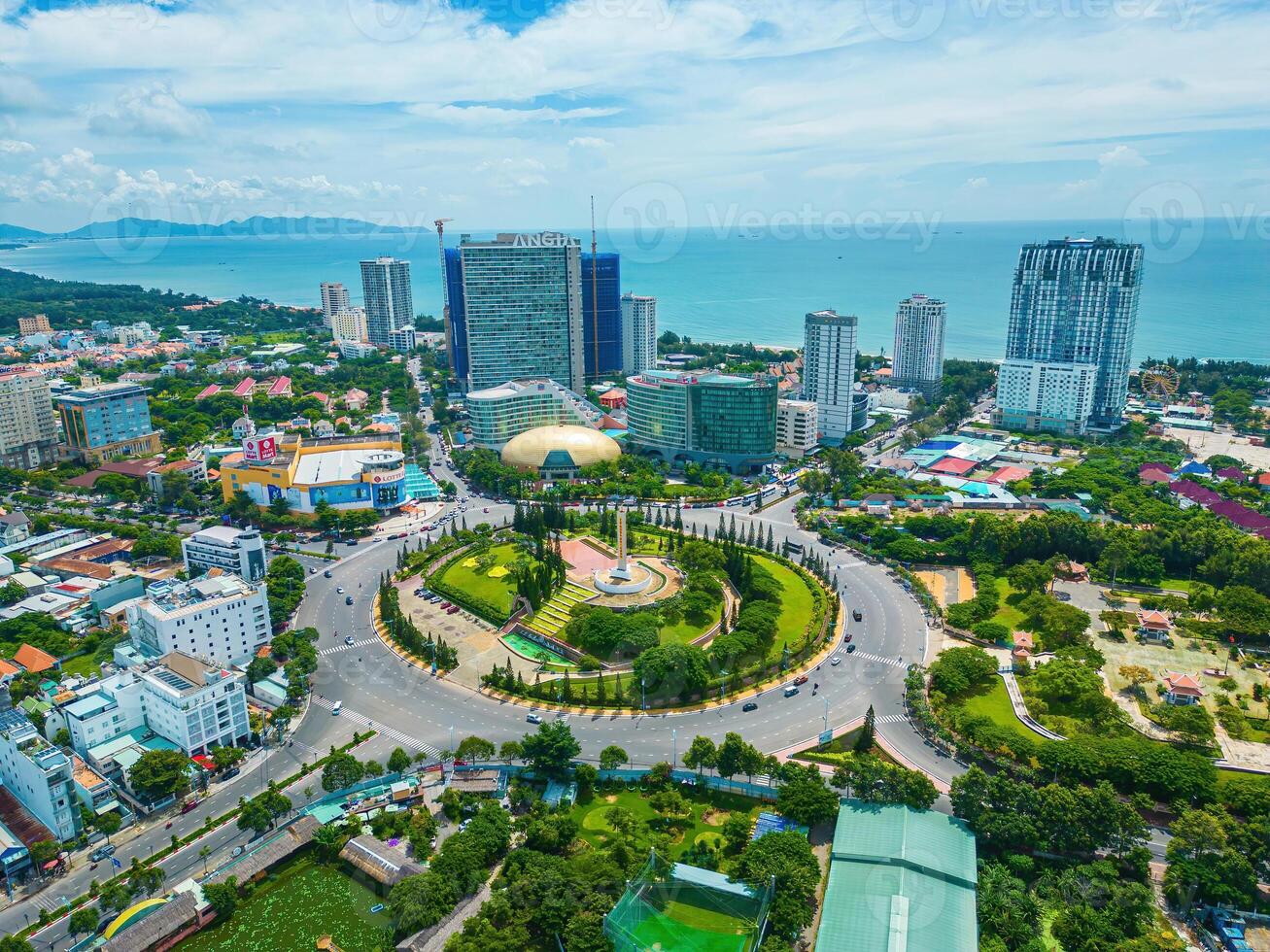 Vung Tau view from above, with traffic roundabout, house, Vietnam war memorial in Vietnam. This is the biggest roundabout in Vung Tau. photo