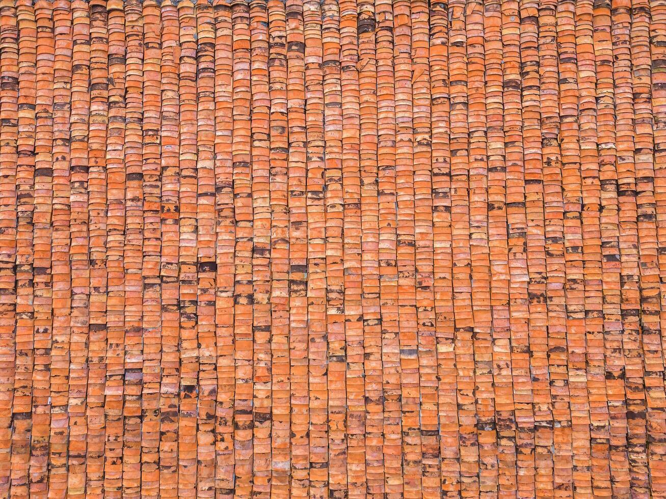 Orange tiles pattern background, Details of new modern orange roof brick, Shingles texture, Abstract geometric pattern, Roof top material of old house photo