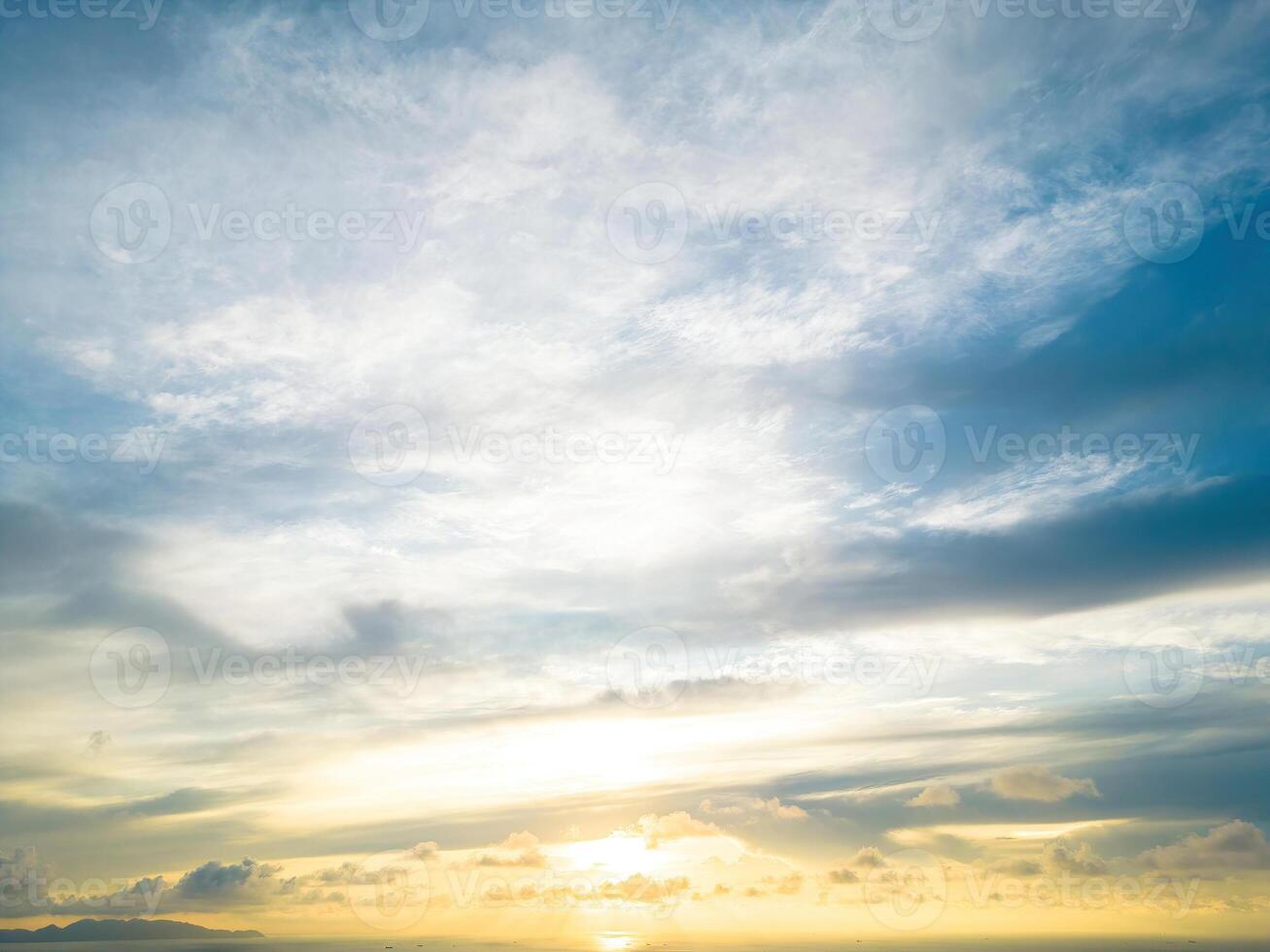 Beautiful view of blue sky with clouds at sunrise. Partly cloudy.Background cloud summer. Cloud summer. Sky cloud clear with sunset. Natural sky cinematic beautiful yellow and white texture background photo