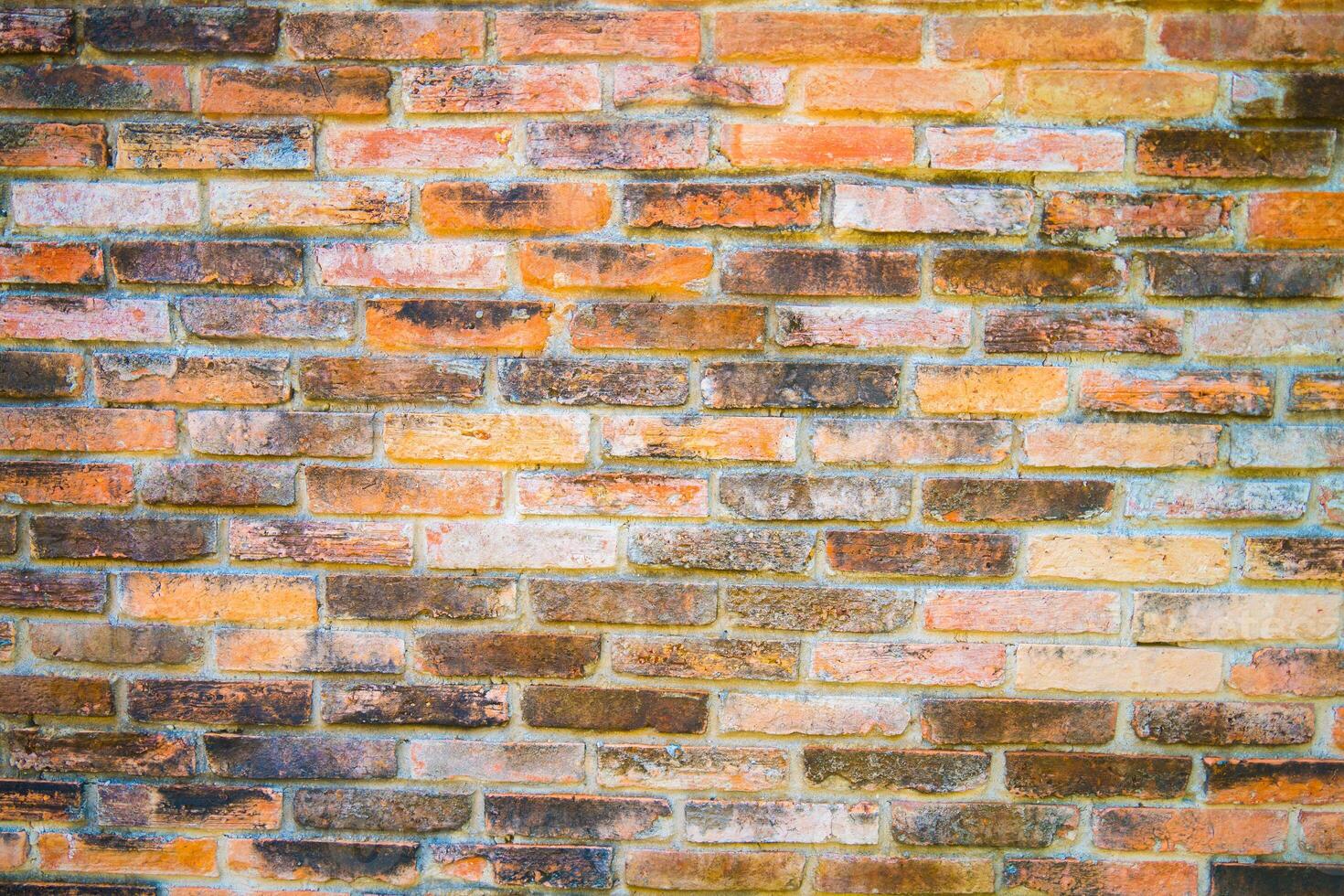 Red brick wall. Texture of old brown and red brick wall background. Fragment of red brick wall closeup. The structure of the background. Template for an inscription. Mockup for designs. photo