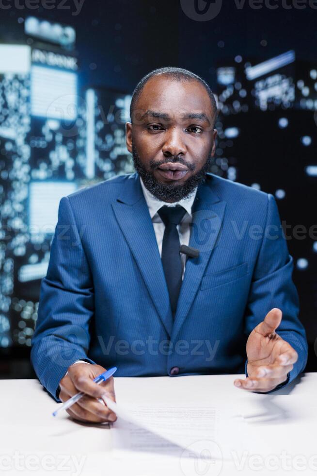 TV newscaster presenting live events on television network to create exclusive content, reading latest information. Media reporter broadcasting international news in newsroom, show host. photo