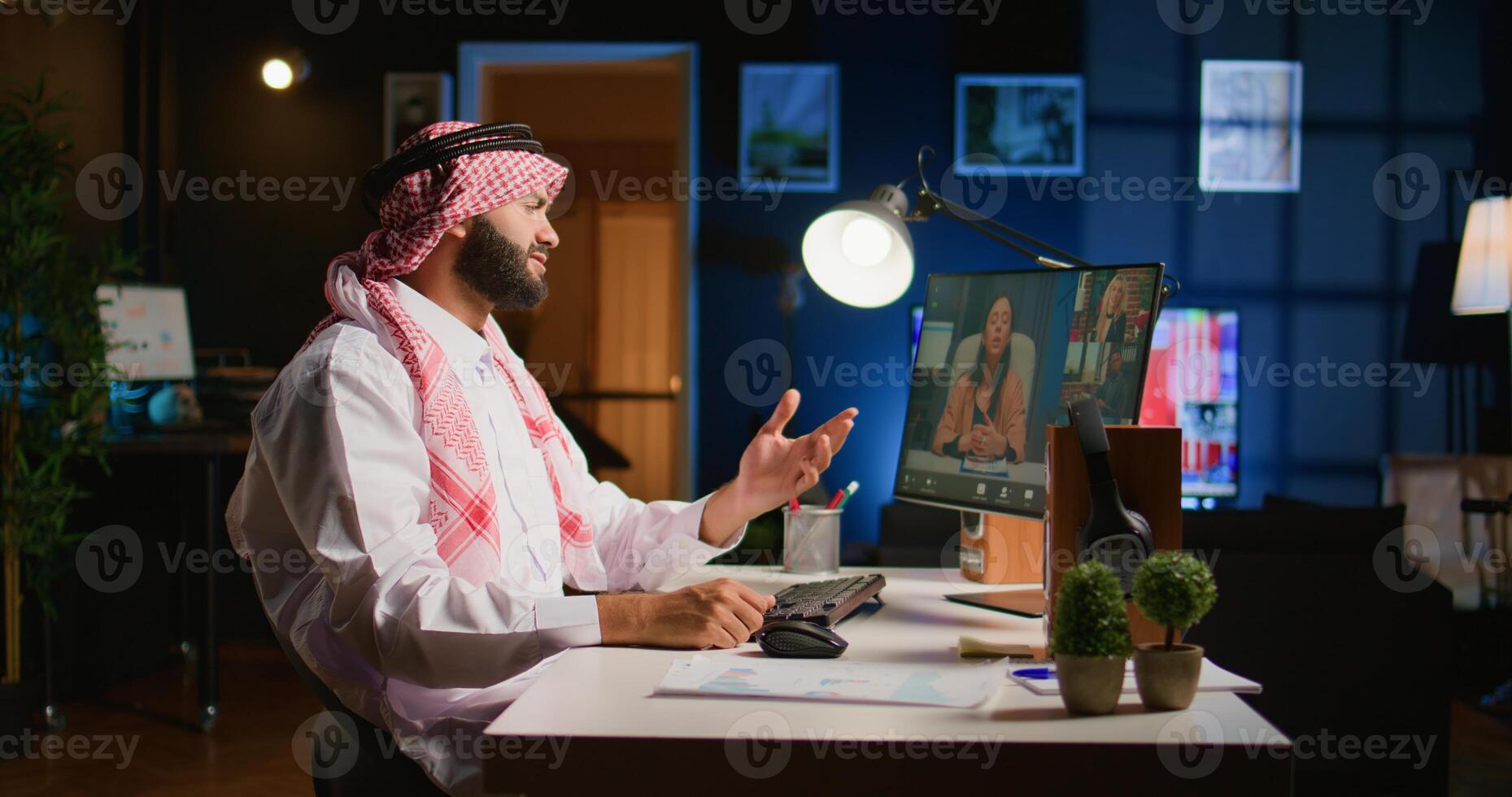 Arab team leader holding online conference meeting with remotely working subalterns, checking on task progress. Islamic business executive discussing with employees during call photo