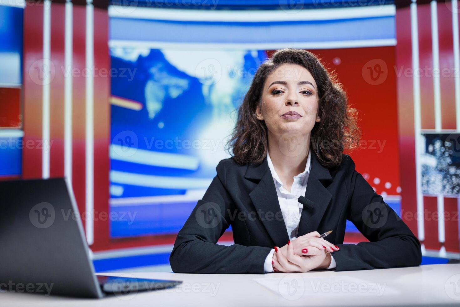 Live stories transmitted by journalist in newsroom, covering latest headlines and providing details for worldwide. Television broadcaster discusses recent happenings and commercials. photo