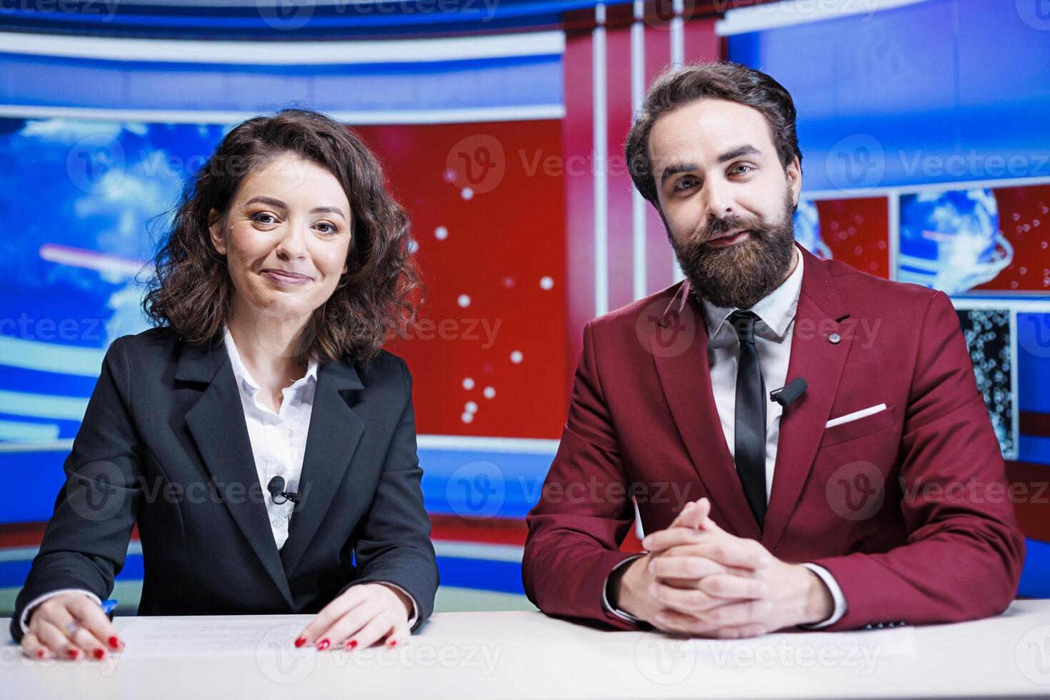 Media newscasters going live on tv to deliver breaking news and global events, broadcasting morning show content on television program network. Team of reporters reading headlines in newsroom. photo